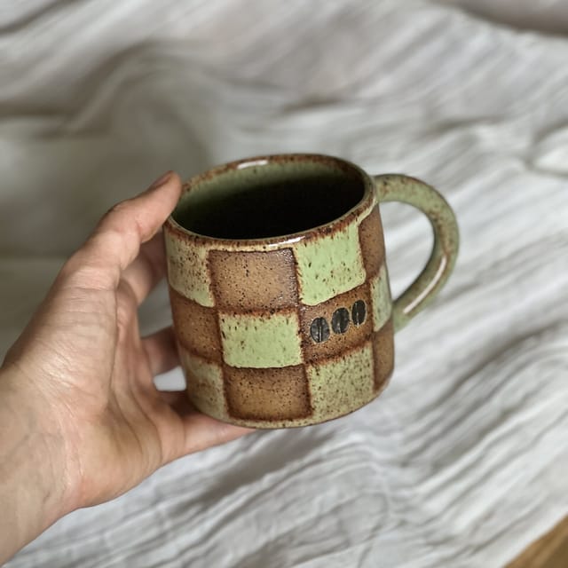 Sage Checkerboard Mug — A hand-painted sage checkerboard mug with a little carved three-dot signature