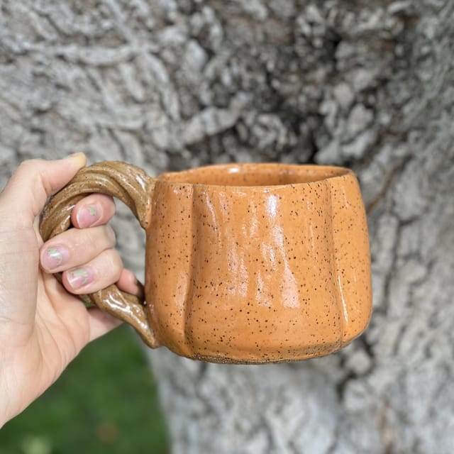 Pumpkin Patch Mug — A lobed pumpkin mug with a twisted rope handle